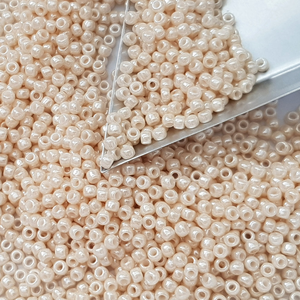 8/0 toho Seed beads in Lt Beige Luster Opaque TR-123 triangle scoop.