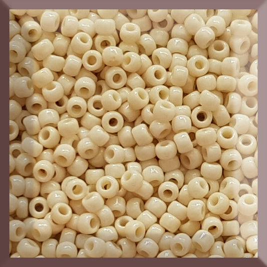 8/0 Toho seed beads in Lt Beige Opaque TR-51 in a square window.
