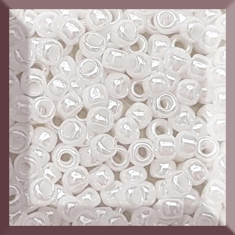 8/0 Toho Seed Beads in white Luster Opaque TR-121 close square window.