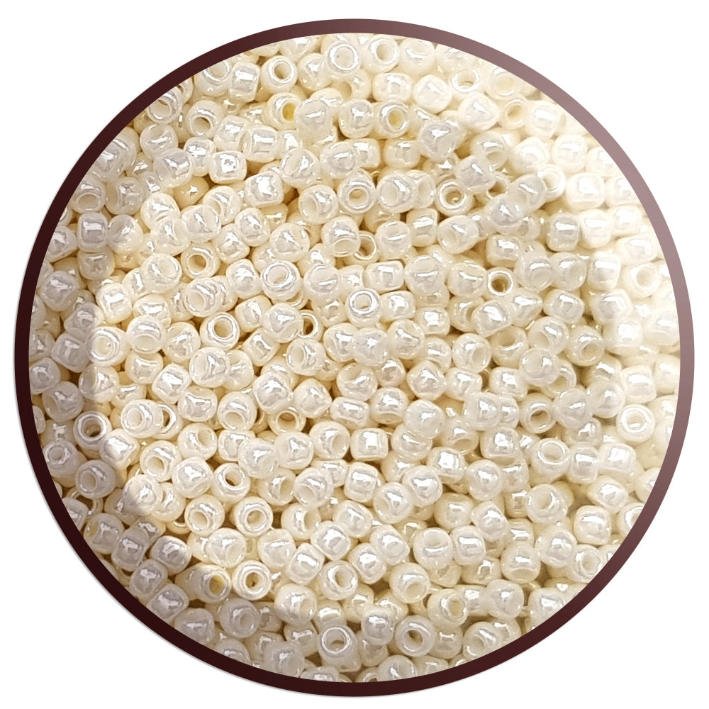 8/0 Toho Seed Beads in white Navajo luster opaque TR-122 in a circle white background,