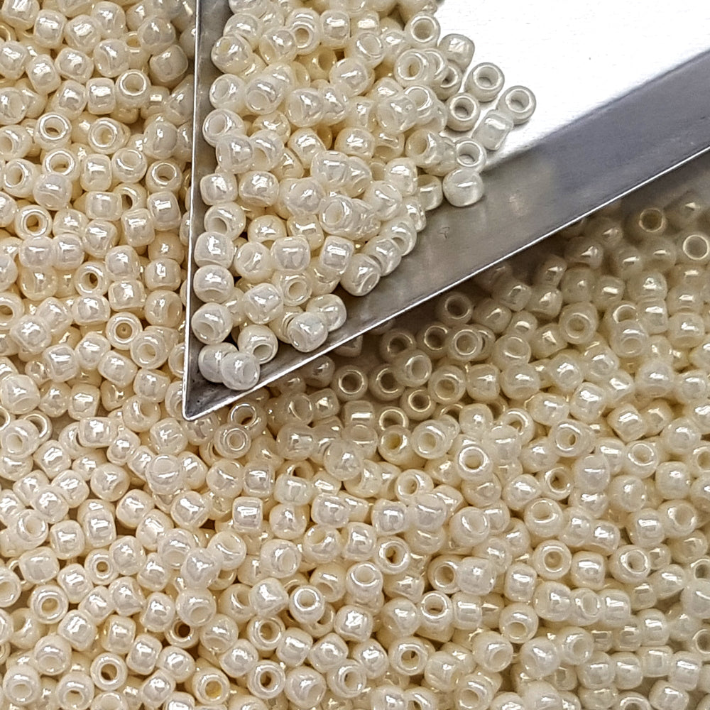 8/0 Toho Seed beads in white Navajo luster opaque TR-122 with a triangle scoop