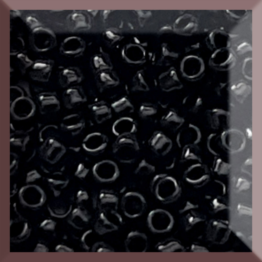 Toho seed beads 15/0 jet black opaque TR-49 in a square.