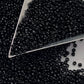 Toho seed beads 15/0 jet black opaque TR-49 with a triangle scoop.